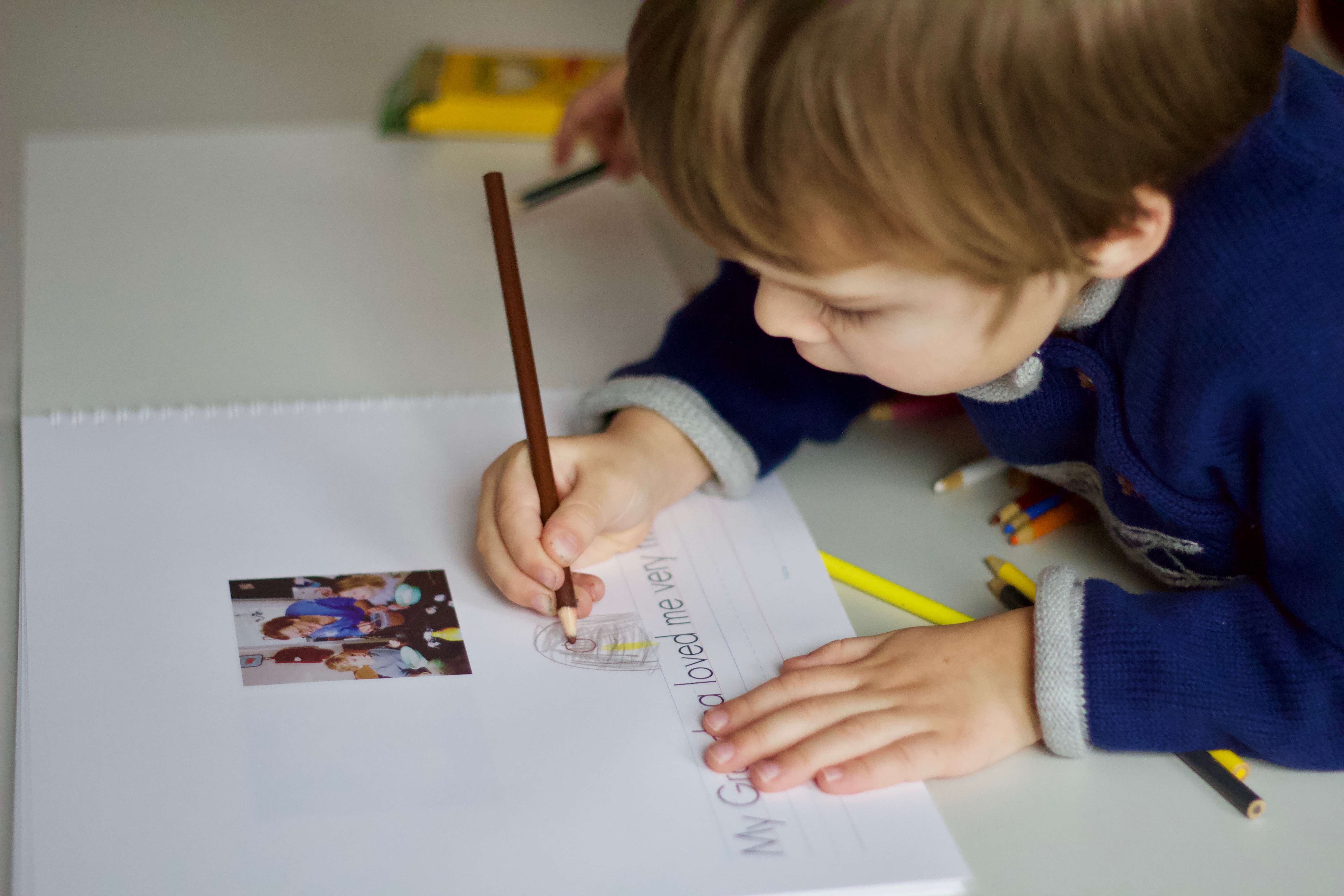 Child-drawing-in-personalized-notebook